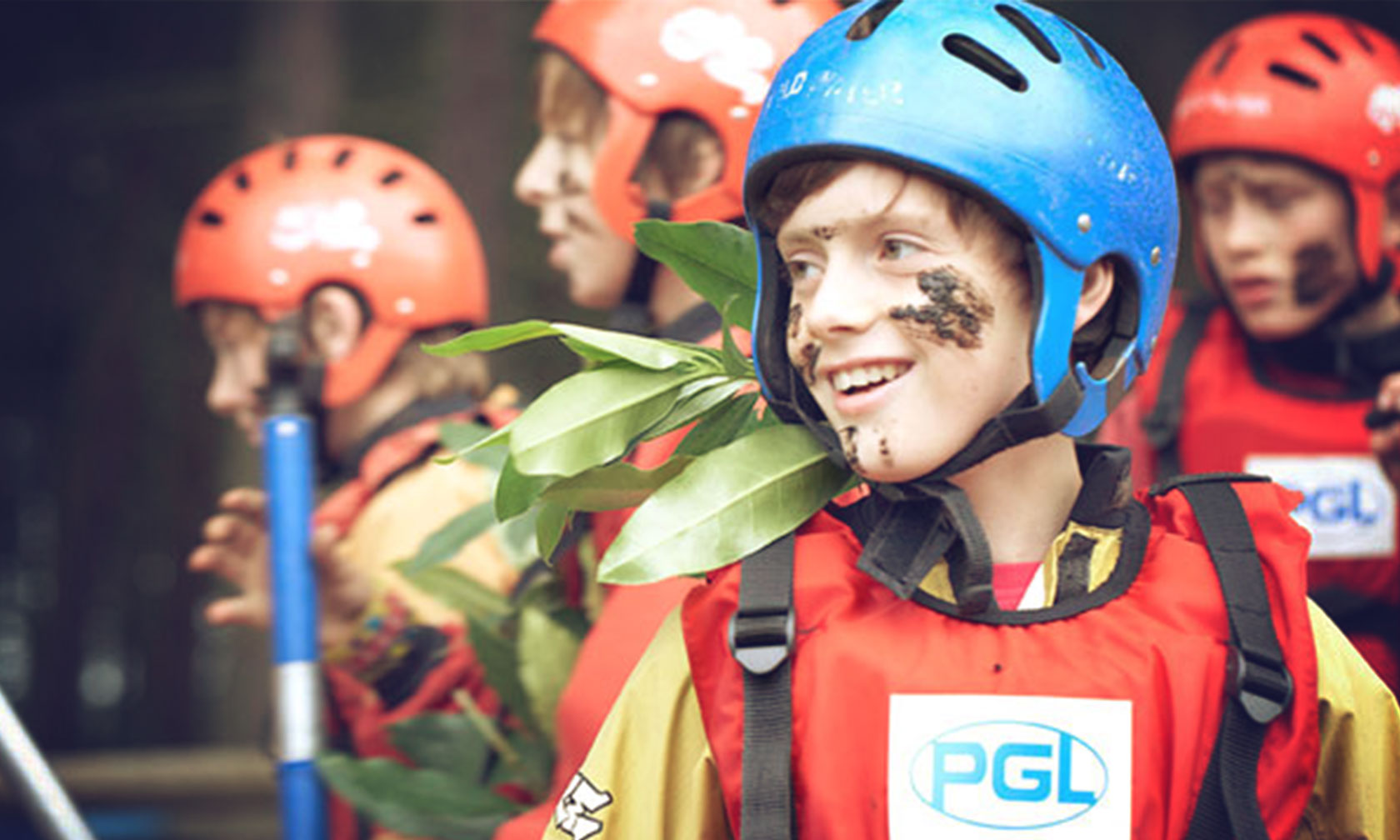 PGL boy with mud on face