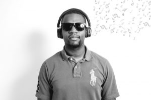 An image showing Carl at Bluestep wearing headphones